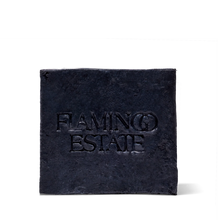 Black square soap with 'Flaming Estate' text on a white background