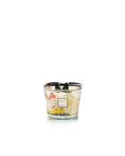 Decorative candle with floral design on a white background