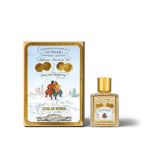 Perfume bottle and packaging with decorative design on a white background