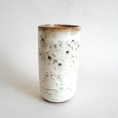 Spako Clay tumbler black line drawing of flowers and emboss pattern, white glaze
