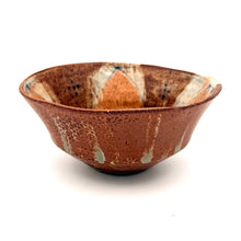 Ceramic bowl with a textured surface on a white background