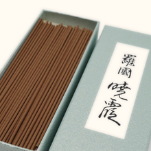 Incense sticks in a box with Japanese text on a white background