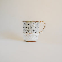 Spako Clay mug, geometric design. Mug handle on right