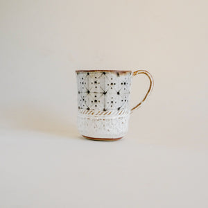 Spako Clay mug, geometric design. Mug handle on right