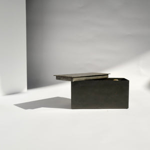 Rectangular Black block forged metal Mad et Len Potpourri - Amber Black Block Horizontal. Lid partially opened. 