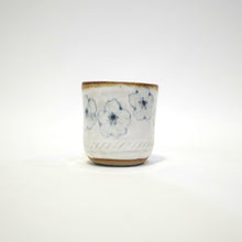 Spako Clay Espresso Cup blue and white glaze. Multiple blue flower Pattern.