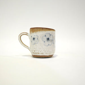 Spako Clay Espresso Cup blue and white glaze. Multiple blue flower Pattern. Handle on left