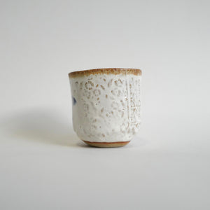 Spako Clay Wide Tumbler floral texture on white glaze