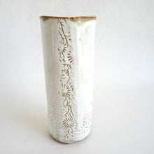 Hand holding a Spako Clay extra Tall Vase floral embossing, white glaze