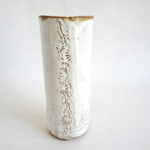 Hand holding a Spako Clay extra Tall Vase floral embossing, white glaze