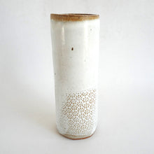 Hand holding a Spako Clay extra Tall Vase floral floral embossing pattern, white glaze