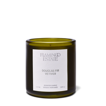 Green candle with a white label on a white background