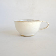 Cappuccino mug on beige background