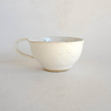 Cappuccino mug on beige background