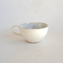 Cappuccino mug on beige background