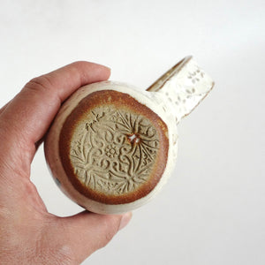 Spako Clay mug. Emboss pattern, white glaze