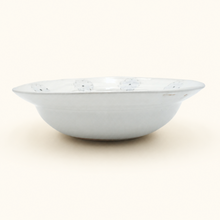 White ceramic bowl on a white background