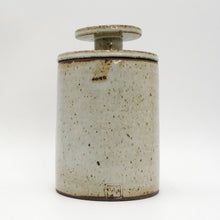 MH Ceramic Studio Speckled ceramic jar with a lid on a white background