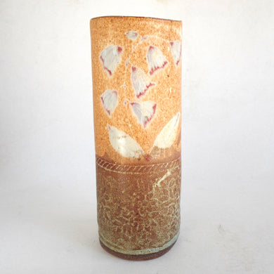 Cylindrical ceramic vase with butterfly design on a white background