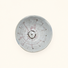 Bowl with floral pattern on white background