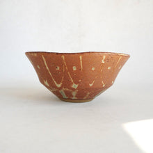 Ceramic bowl with decorative patterns on a white background