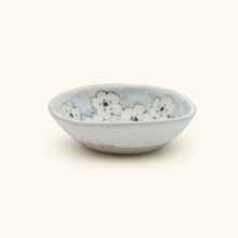 Spako Clay ceramic dish with floral pattern on a white background