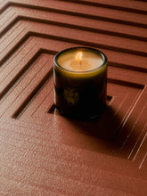 Flamingo estate candle on stepped surface