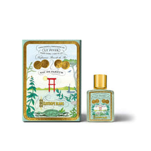 Perfume bottle and packaging with artistic design on a white background