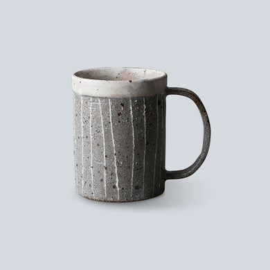 Textured ceramic mug on a light gray background
