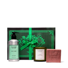 Flamingo Estate gift set with soap, candle, and bar of soap on a white background