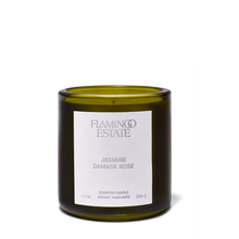 Green candle with a white label on a white background
