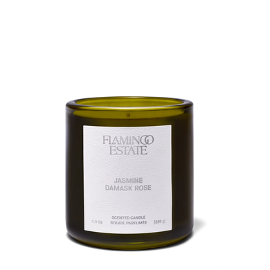 Green candle with a white label on a white background