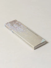 Rectangular box with floral design on a light background