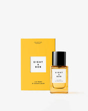 Eight & Bob perfume bottle with yellow packaging on a white background