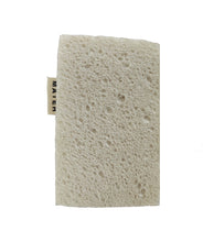 Textured beige sponge with a brand tag on a white background