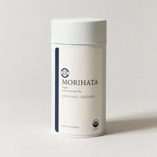 A white cylindrical canister of MORIHATA Organic Leaf-Led Green Tea, Hachiyu-Hachiya, on a light gray background.
