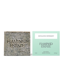 Bar of soap and its packaging with 'Flamingo Estate' branding on a white background