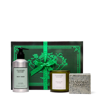 Flamingo Estate gift set with body wash, candle, and soap on a white background