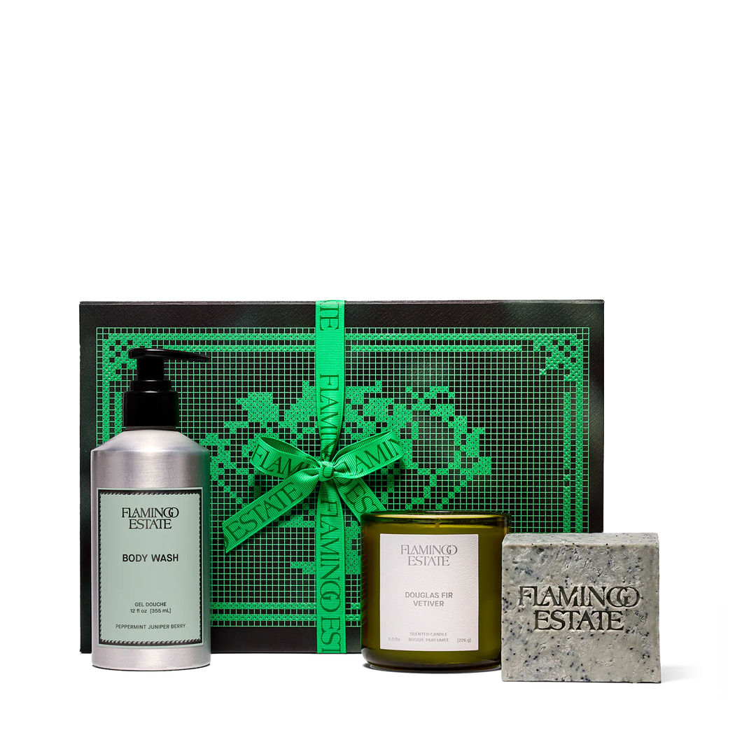 Flamingo Estate gift set with body wash, candle, and soap on a white background