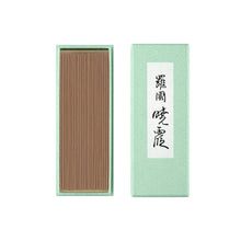 Incense sticks in a green box with Japanese text on a white background