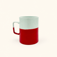 Red and white mug on a white background 