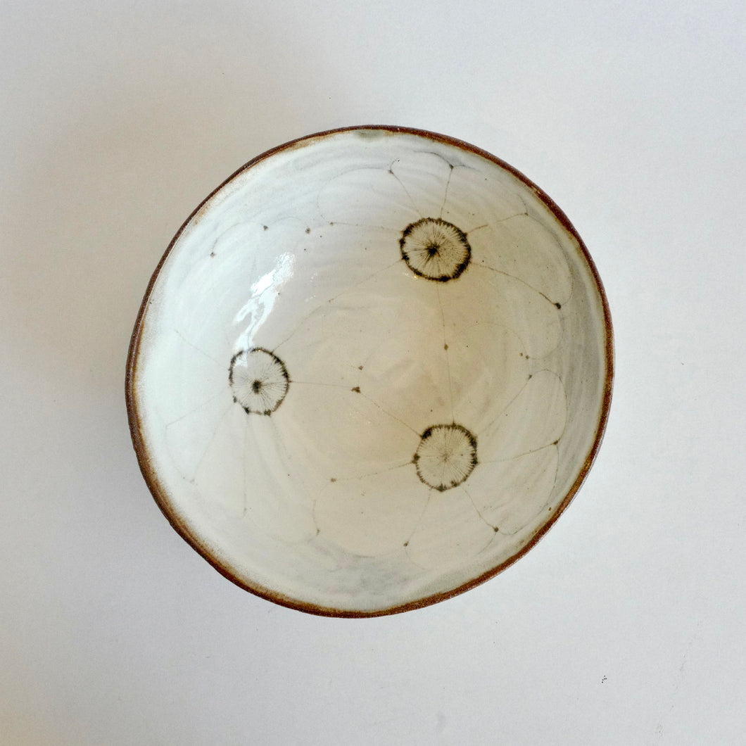 Three large brown flower pattern in bowl