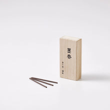 Incense stick and wooden box on a white background