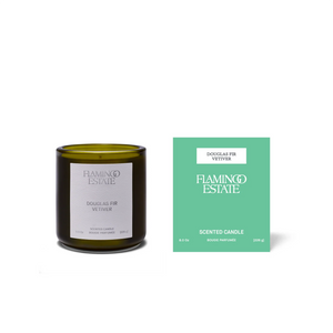 Scented candle and its packaging with 'Flamingo Estate' branding on a white background
