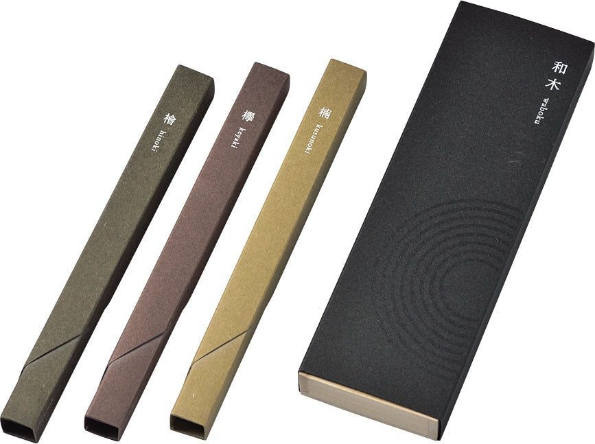 Set of three different incense boxes and a black packaging box with circular pattern on a white background.