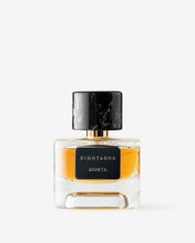 Eight & Bob Perfume bottle with black cap and clear body on a white background
