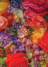 Close-up of a colorful bouquet of flowers with red, yellow, and purple colors.