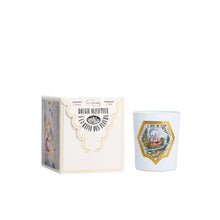 Candle with decorative packaging on a white background