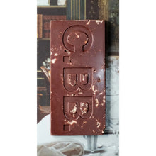 Chocolate bar with 'C.BB.' branding against a blurred background