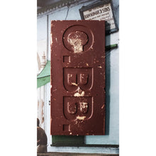 Chocolate bar with a visible brand logo on a blurred background